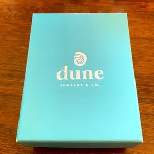 Sterling silver necklace crafted using sand and natural elements from Cape Cod.